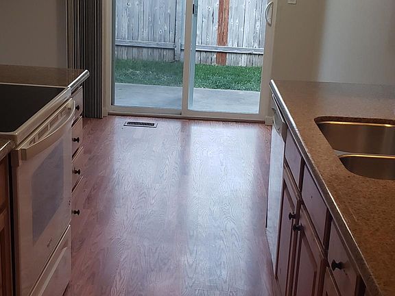 Kitchen from the garage door entry area, looking into dining room