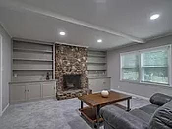 Spacious den with fireplace