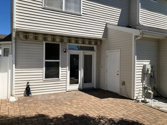Outside storage shed, patio with awning. Large shade tree, plus two assigned parking spots. Property also has a propane gas grill.