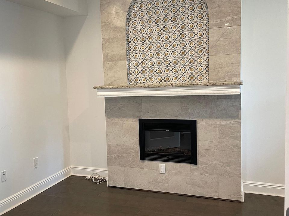 Office with electric fireplace.