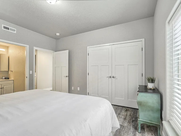 Master bedroom with a king sized bed