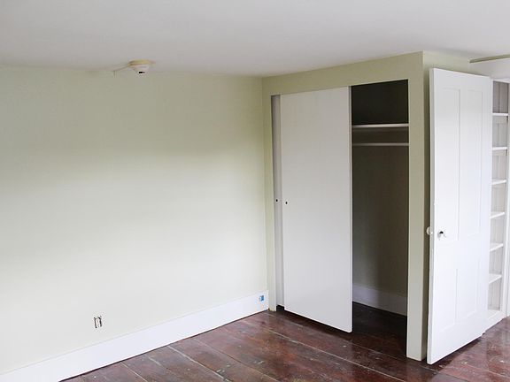 Bedroom with closet and built in shelving
