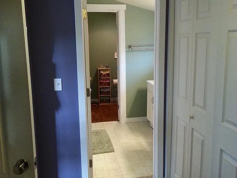 Upstairs bath view from walk-in closet
