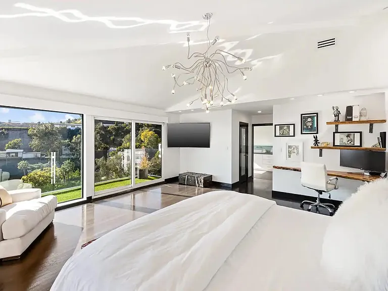 Relax in style in our master bedroom, featuring a king-size bed, Smart TV, ensuite bath, his/hers walk-in closets, and blackout shades.