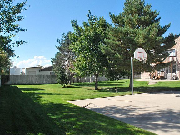 Basketball court and drinking fountains in yard