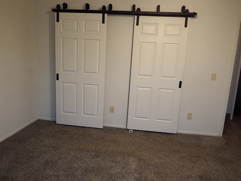 Master bedroom barn doors covering bath/walk-in