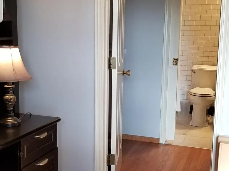 office desk/hutch on left, walk-through closet in the middle, master bath straight through.