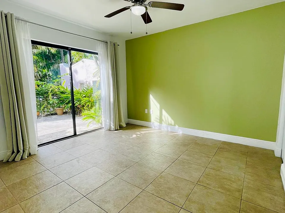 liding glass doors. The bedroom also opens to a beautiful private patio, and its window overlooks and connects directly to the pool area