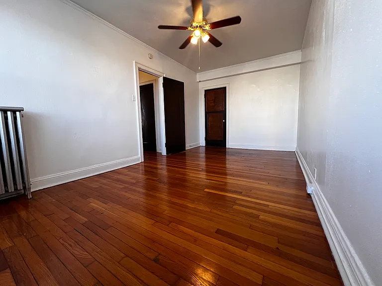 The generously sized bedroom offers plenty of room for larger furniture.