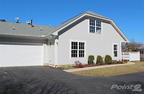 This condominium community features spacious patio homes with two-car garages - AND exterior maintenance is included in your condo dues!