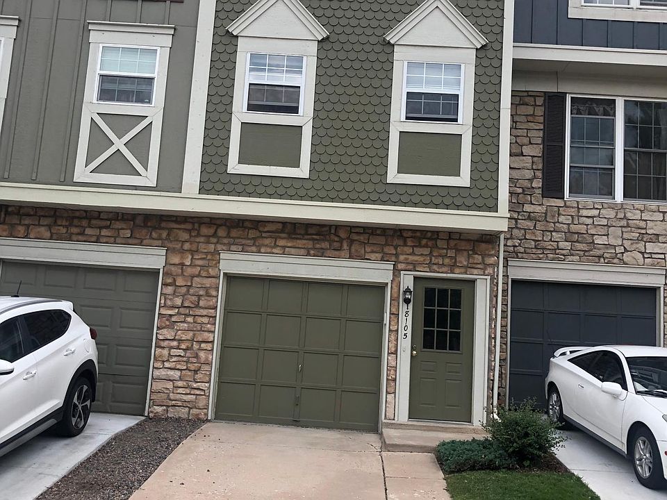 The exterior of the unit: front entrance and garage.