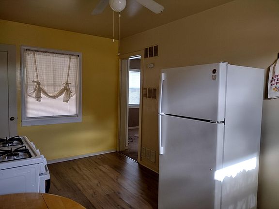Kitchen without the light on and a brand NEW stove