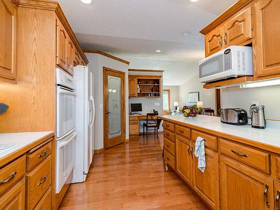 Large galley kitchen with custom Oak Cabinets