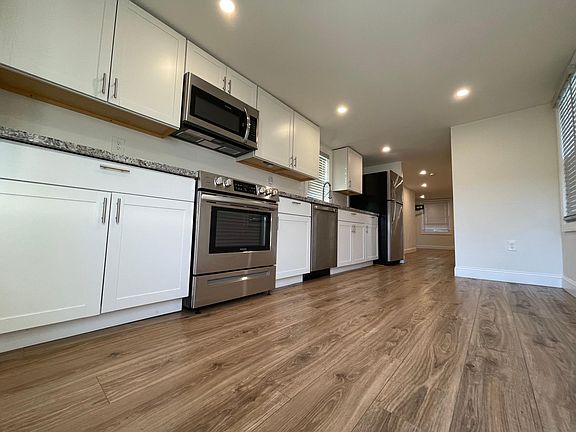 renovated in 2021 - new appliances, countertops and cabinets with built in dishwasher