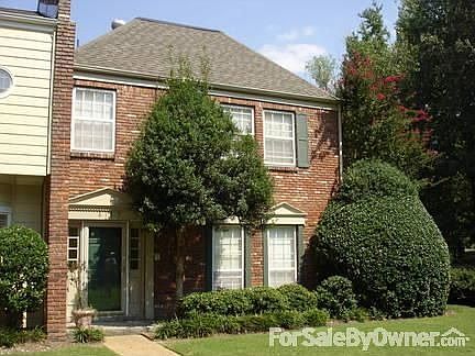 Front entrance faces large park like common grounds adjacent to Golf Course