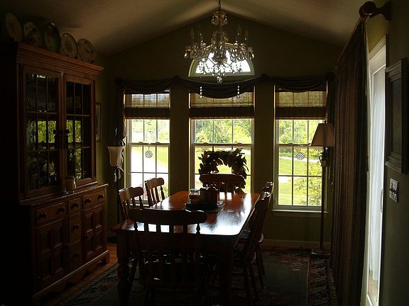 large formal dining room overlooks lake