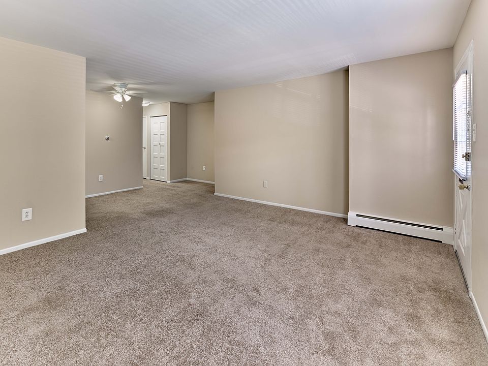 Open and inviting living room with wall-to-wall carpeting at 42 West Apartments in Merchantville, NJ