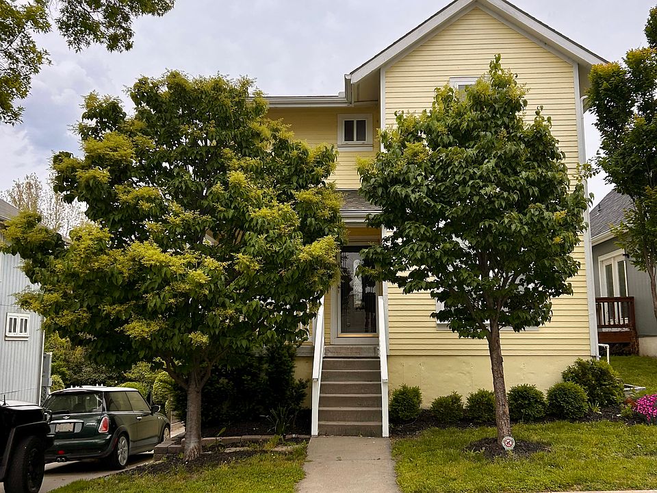 Front of the house... Sorry for the tree cover! But as you can see, it's definitely the happiest house on the block!