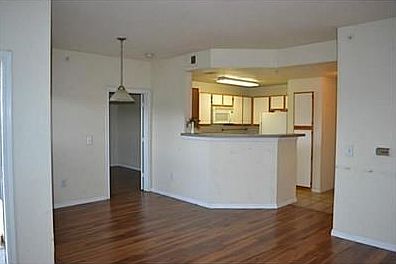 Kitchen opens to living and dining area
