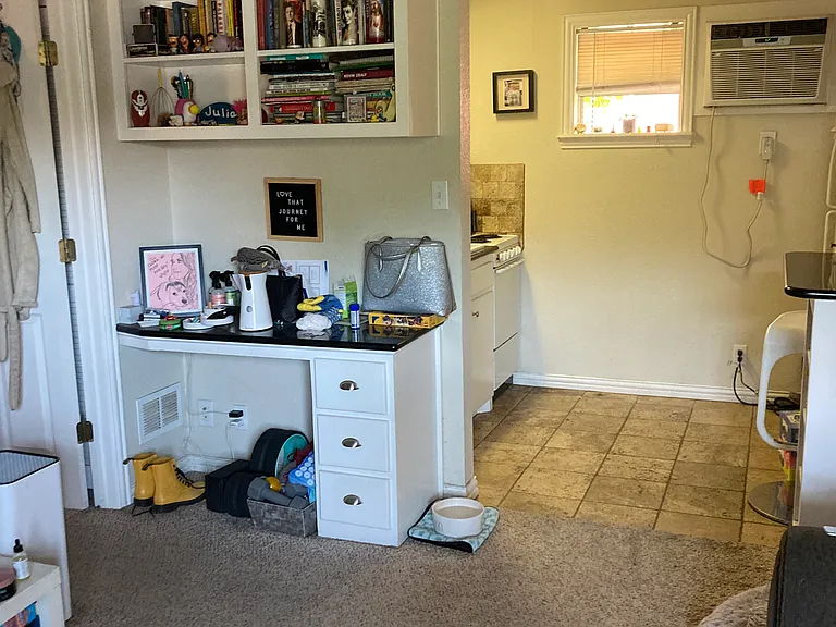 Livingroom flows into kitchen -- nice open feeling -- built-in desk and bookshelves