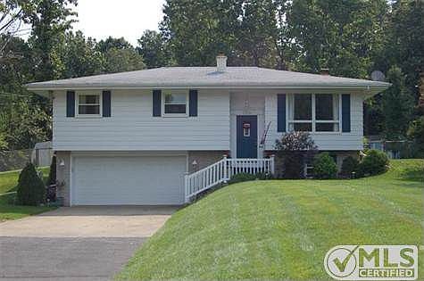 Front view of home and showing the beautiful yard.