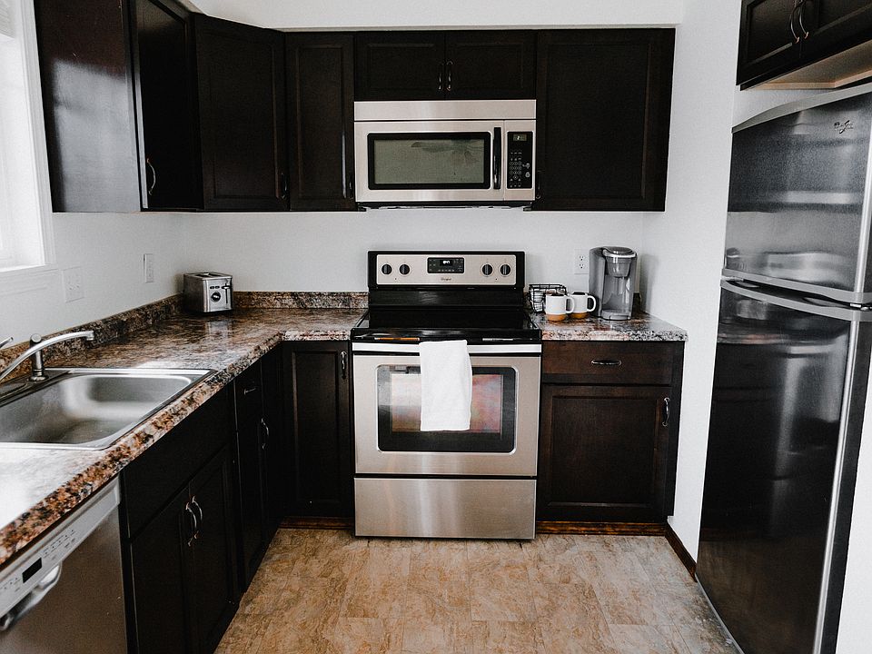 Spacious kitchen with stainless steel appliances.