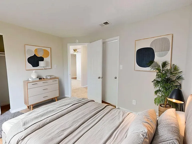 Inviting bedroom showcasing modern decor, elegant furnishings, and serene ambiance with contemporary art and lush greenery. Inviting bedroom showcasing modern decor, elegant furnishings, and serene ambiance with contemporary art and lush greenery.