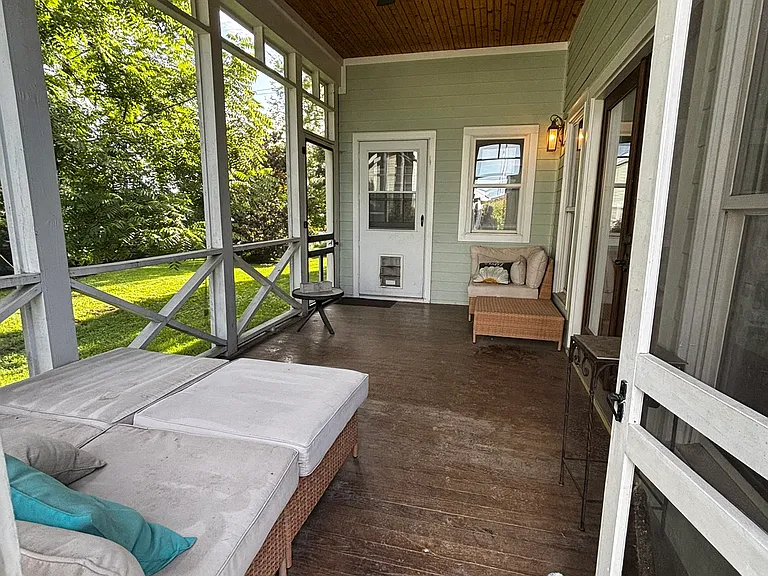 Master bedroom screen-in porch.