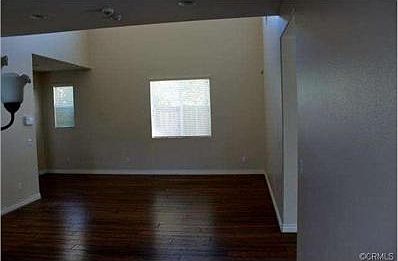 Formal Living Room with high ceilings and wood floors