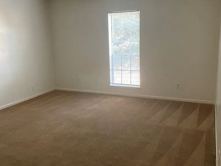 spacious living area open to kitchen