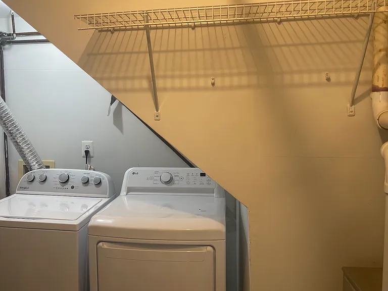 Extra space in laundry room to hang clothes/store cleaning supplies