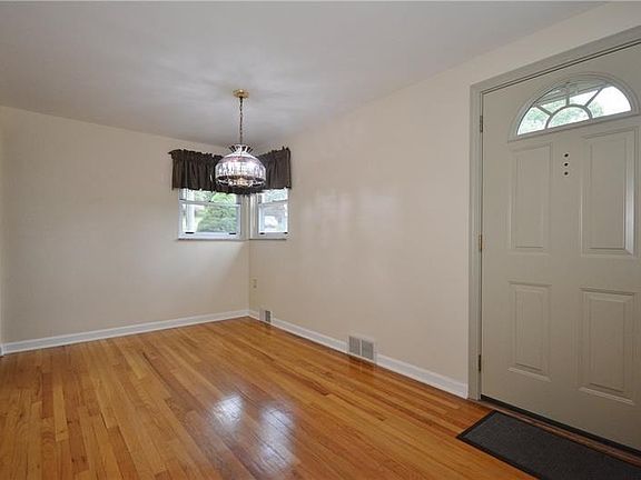 This space can serve as a large entry/foyer, den, or additional dining area.