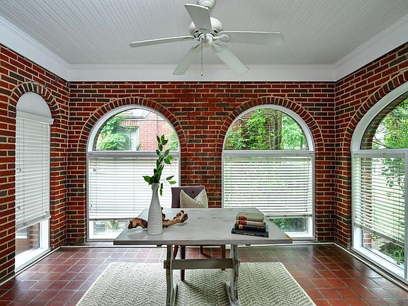 Stunning sunroom with TV hookup, perfect for office or sitting room