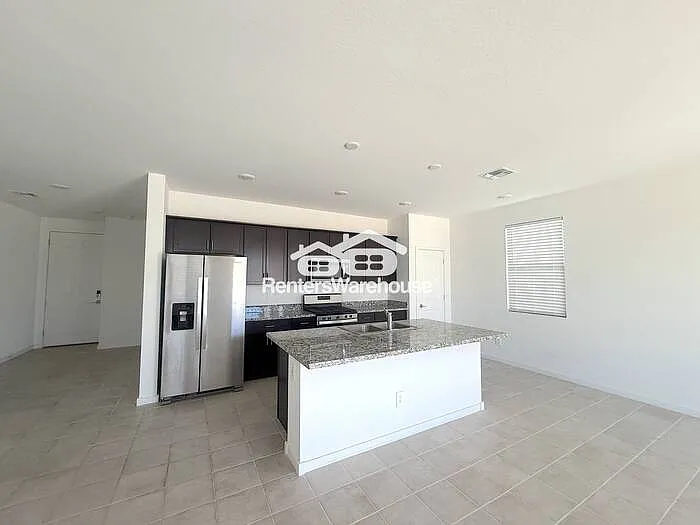 8825 W Albeniz Pl — Photo 4