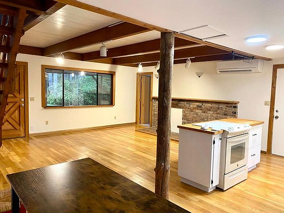 You have just stepped inside the front door. The door to the far right (partially in the photo) is to the laundry room which has plenty of storage. The door in the middle of the photo leads to a spa-like full bath.