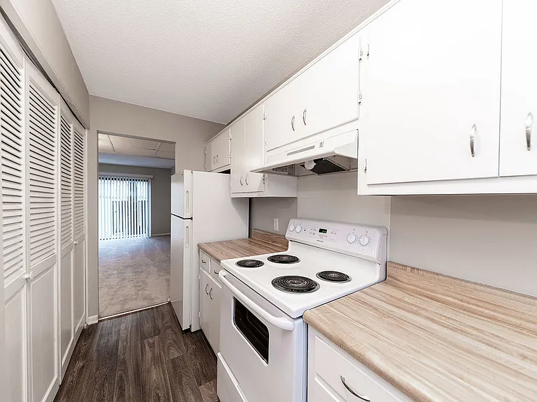 Fully equipped kitchen with generous counter space & cabinetry