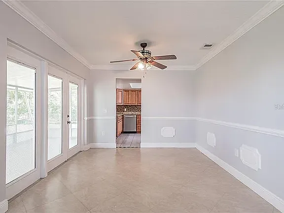 Dining room with french doors to screened back porch