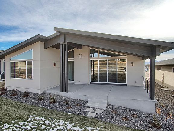 Rear Covered Patio Photo representing home to be built and may demonstrate optional features