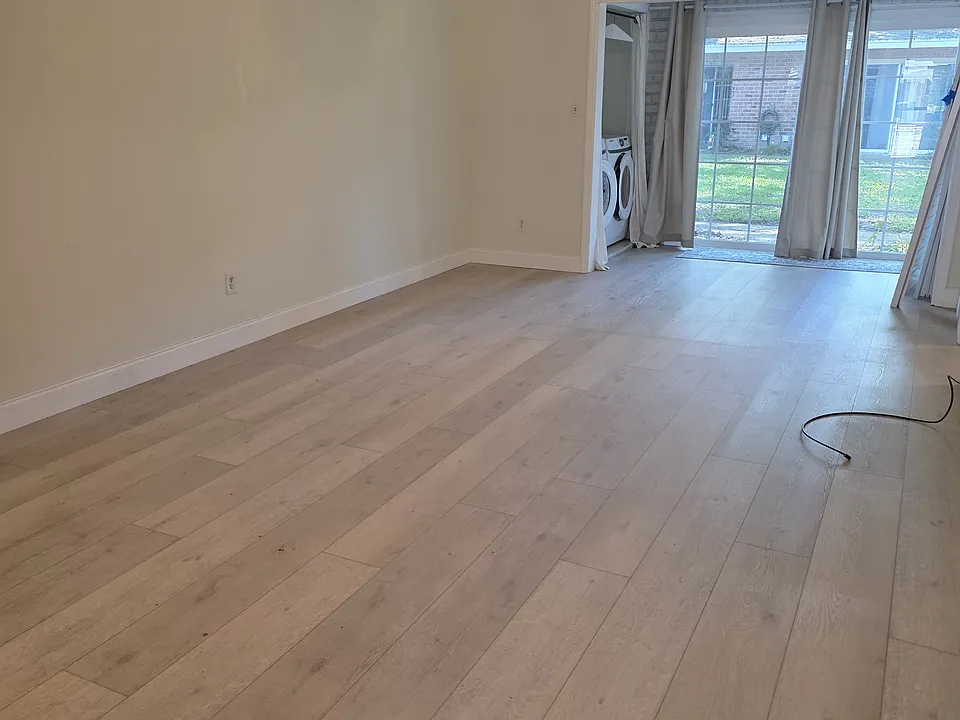 The dinning/living room space looks out on the common area.