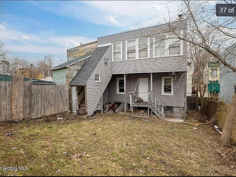 stairs on left from apartment to backyard