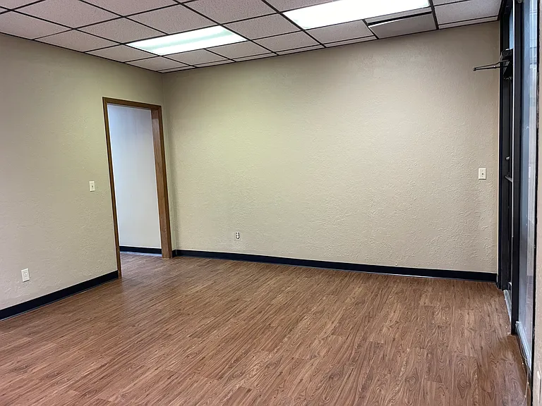 Front office room with door to hallway