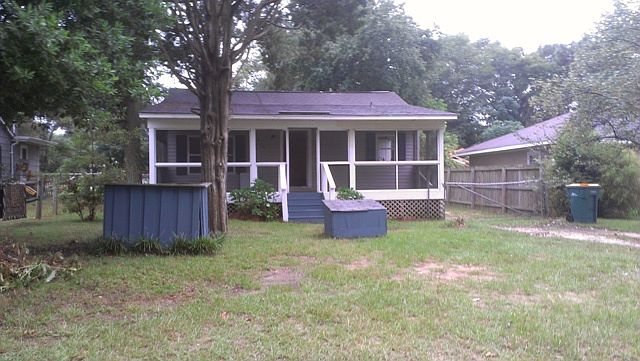 Screened in porch along front of house
