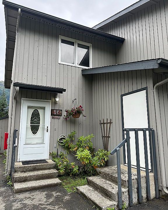 Front entry & attached shed.