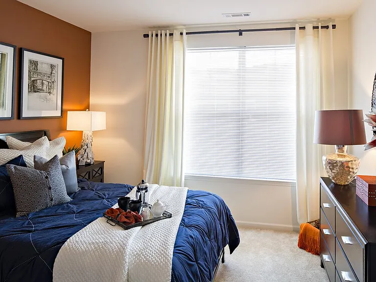 Bedroom with carpet (select homes)