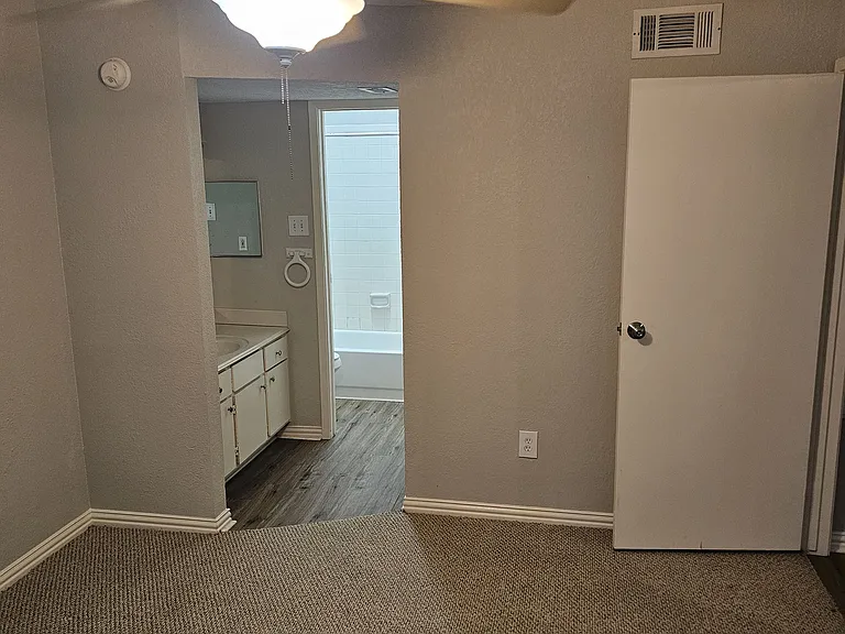 Another view of the primary bedroom