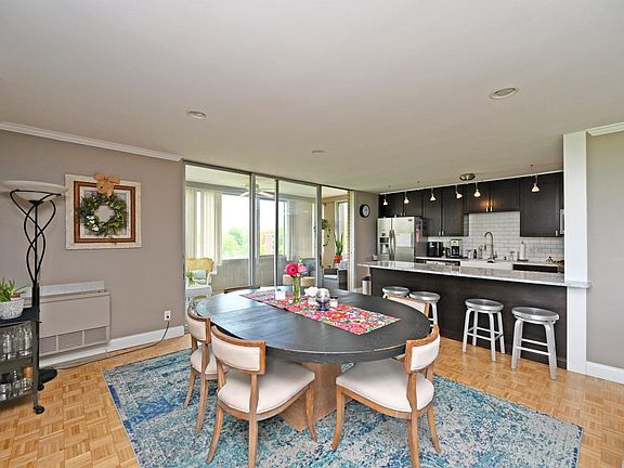 DINING AREA THAT OPENS TO ENCLOSED BALCONLY