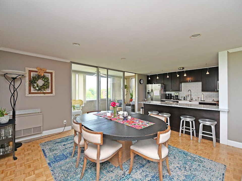 DINING AREA THAT OPENS TO ENCLOSED BALCONLY