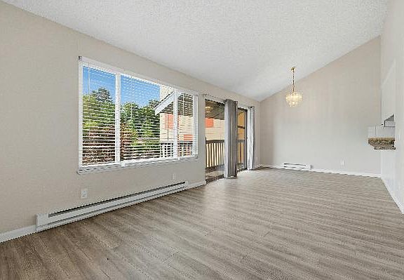 Lots of light in the large living and dining room area 22 feet long by 12' wide! New blinds and flooring throughout.