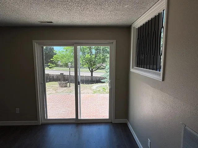 Lower level family area has walkout to brick patio and backyard.