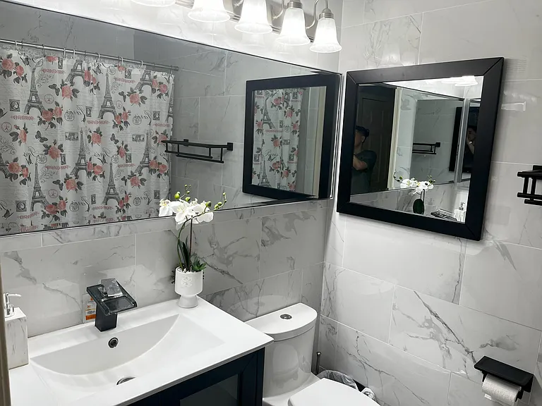 Primary master bathroom with a bathtub